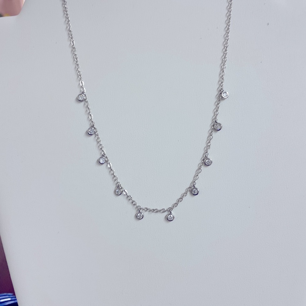 Rhodium plated CZ charm necklace